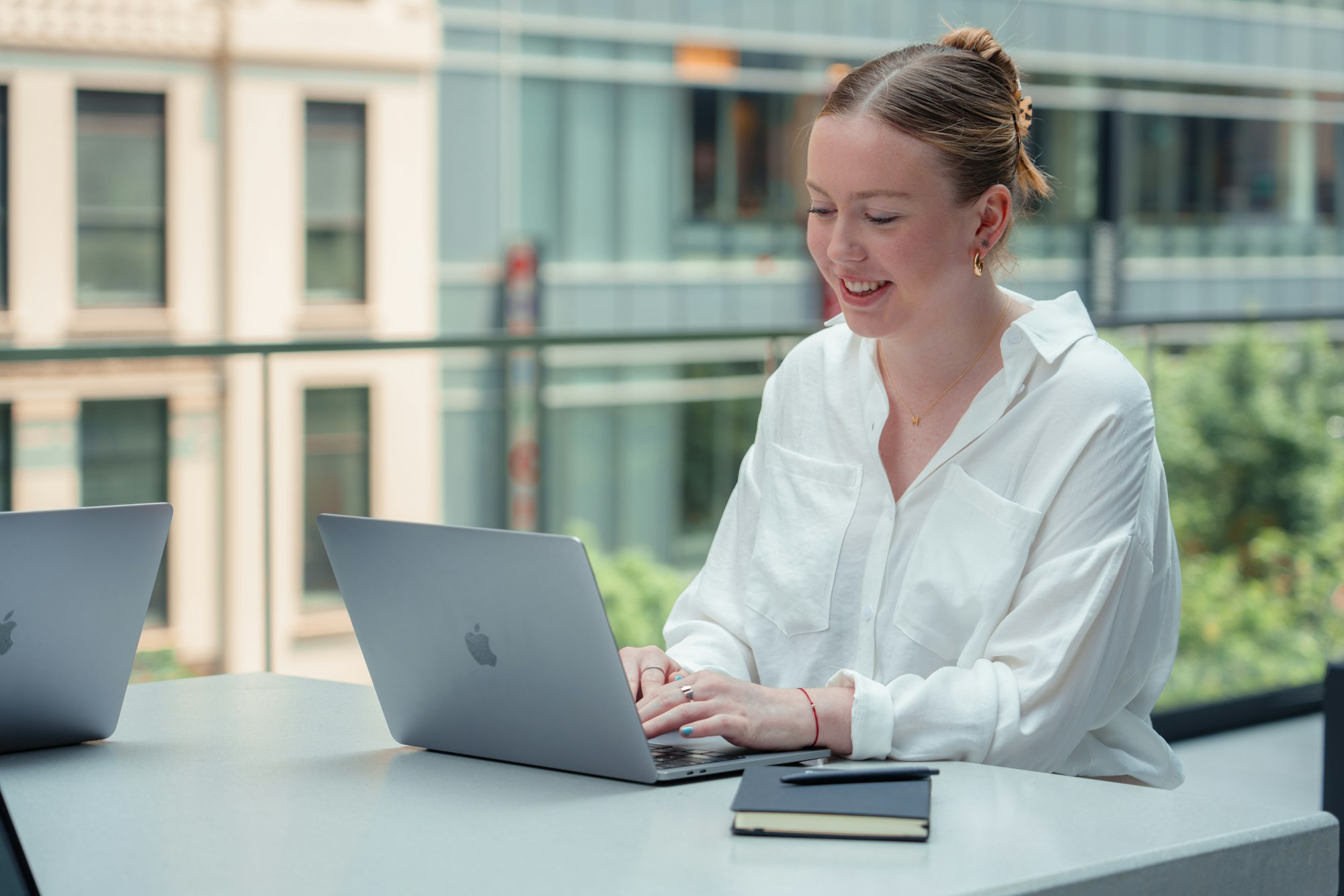 Customer service professional working on a laptop with a chat window open