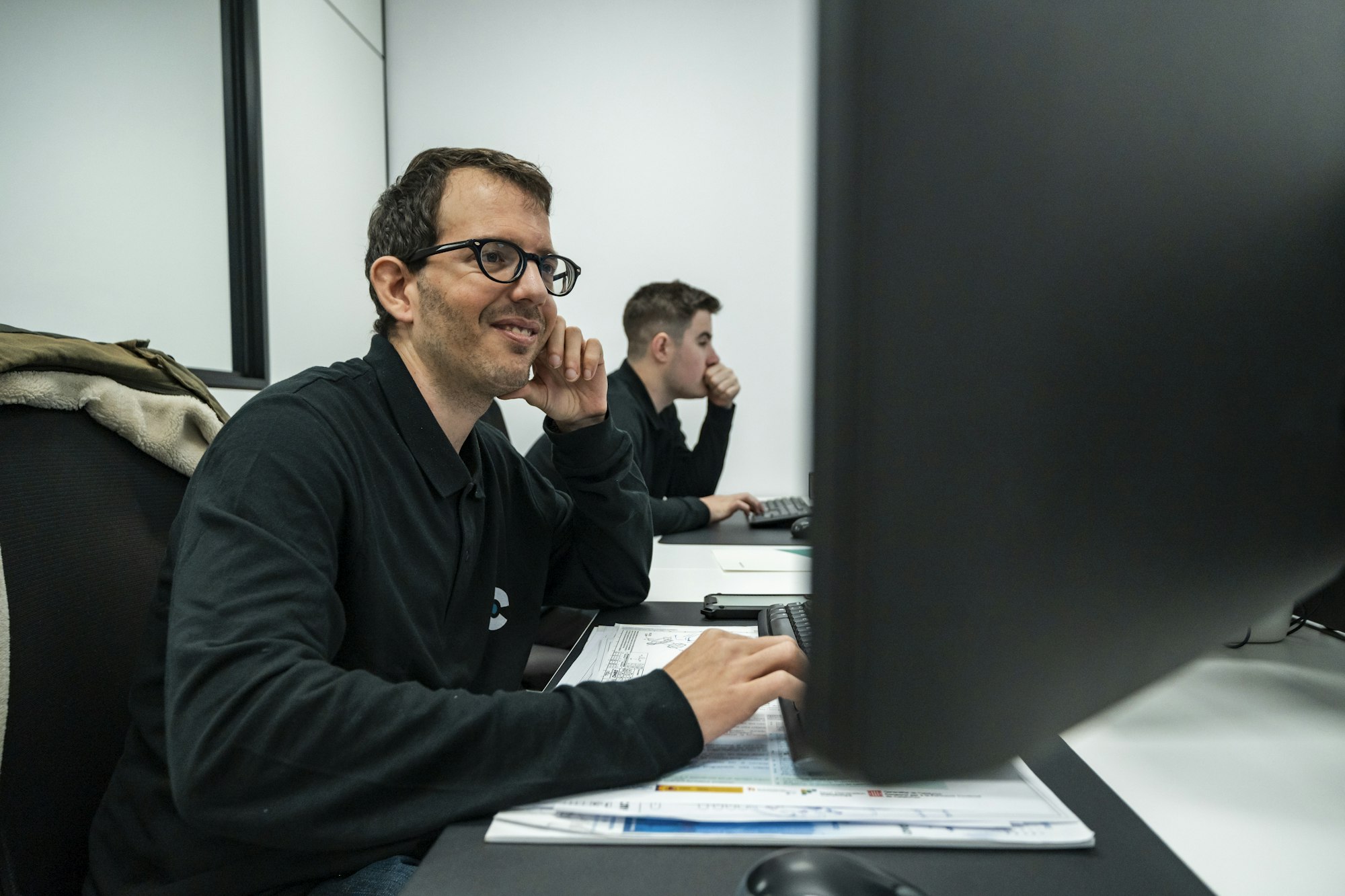 Customer service manager reviewing a support dashboard on a computer