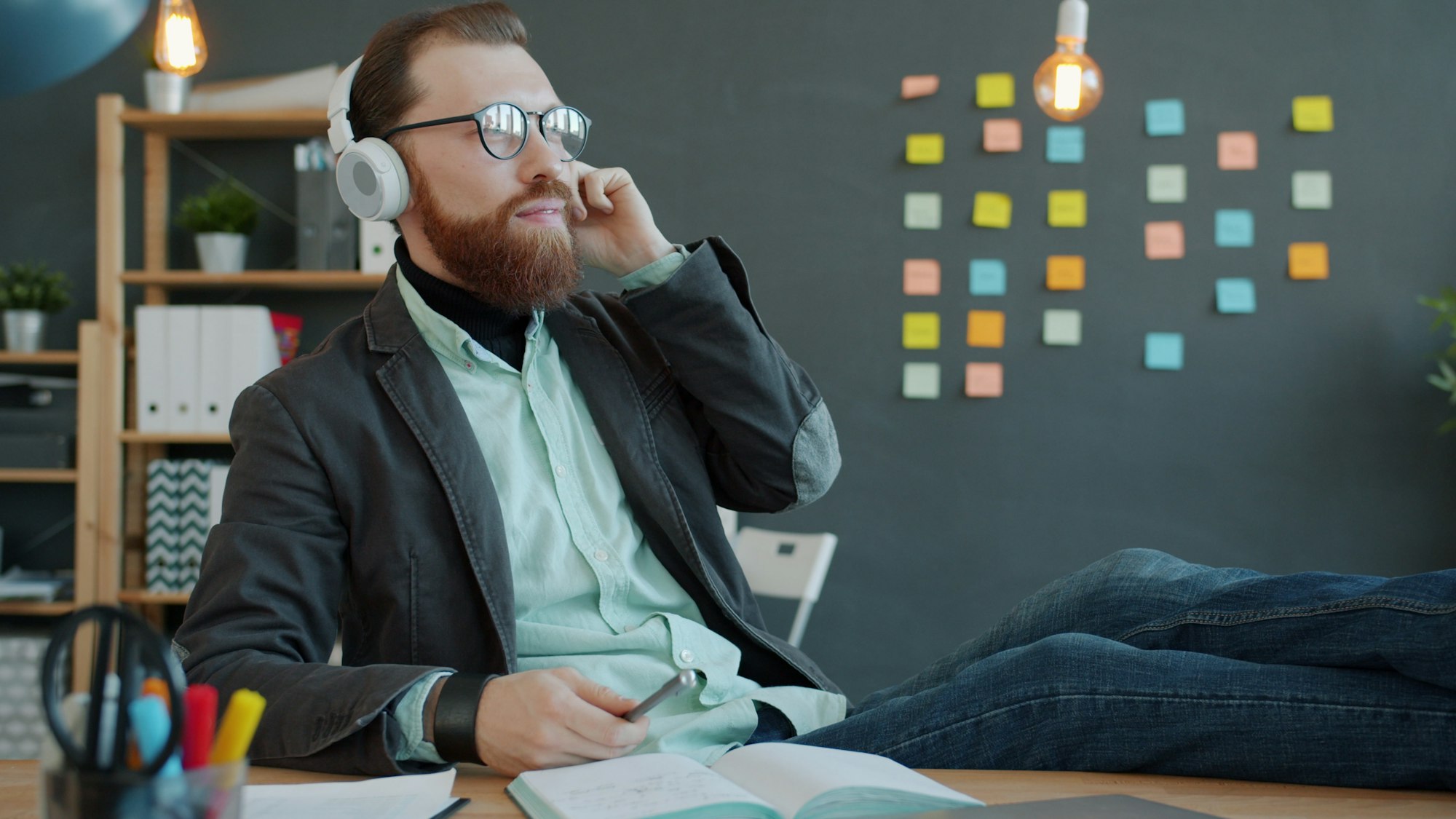 Customer service professional wearing a headset while reviewing a customer case