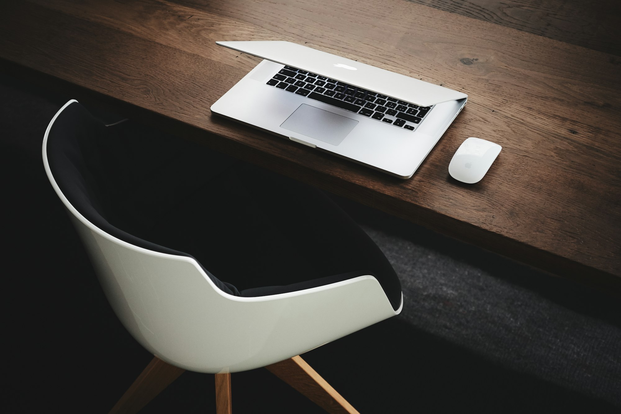 Professional editing a CV on a laptop at a desk