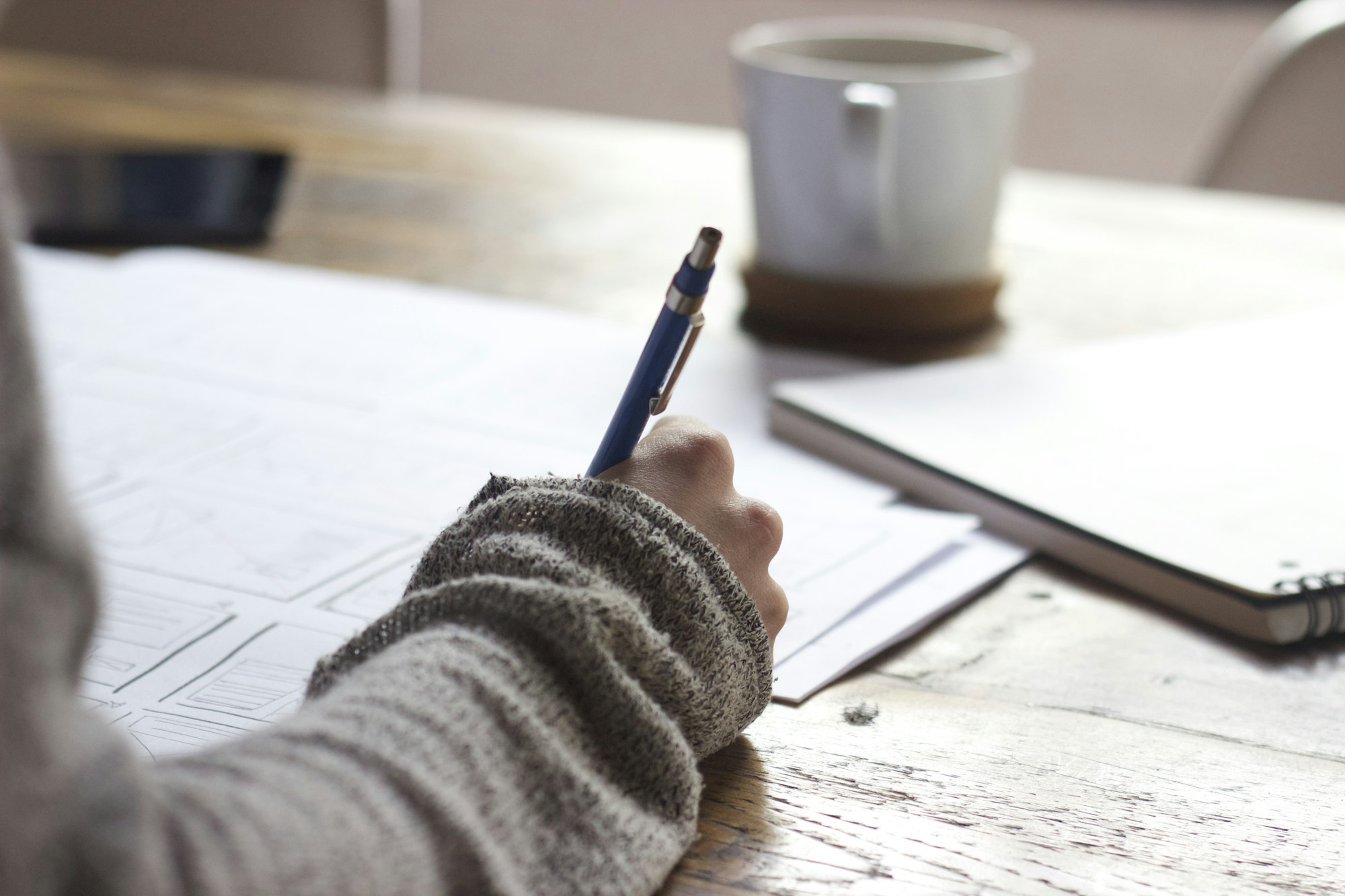 Professional planning a career pathway with a notebook and laptop