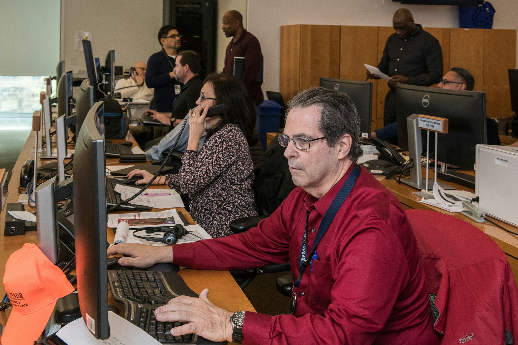 Contact centre team huddle with a supervisor briefing agents