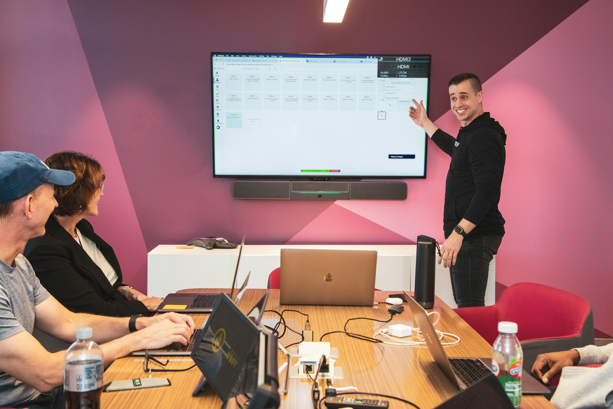 Customer support team reviewing a new process on a screen during a training session