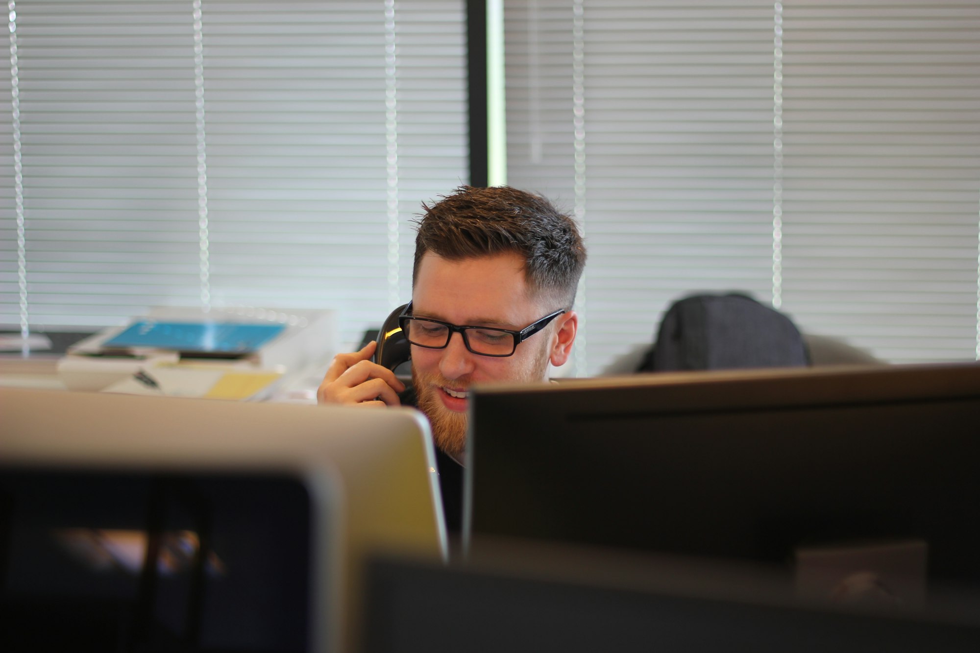 A customer support professional responding to a customer query on a computer