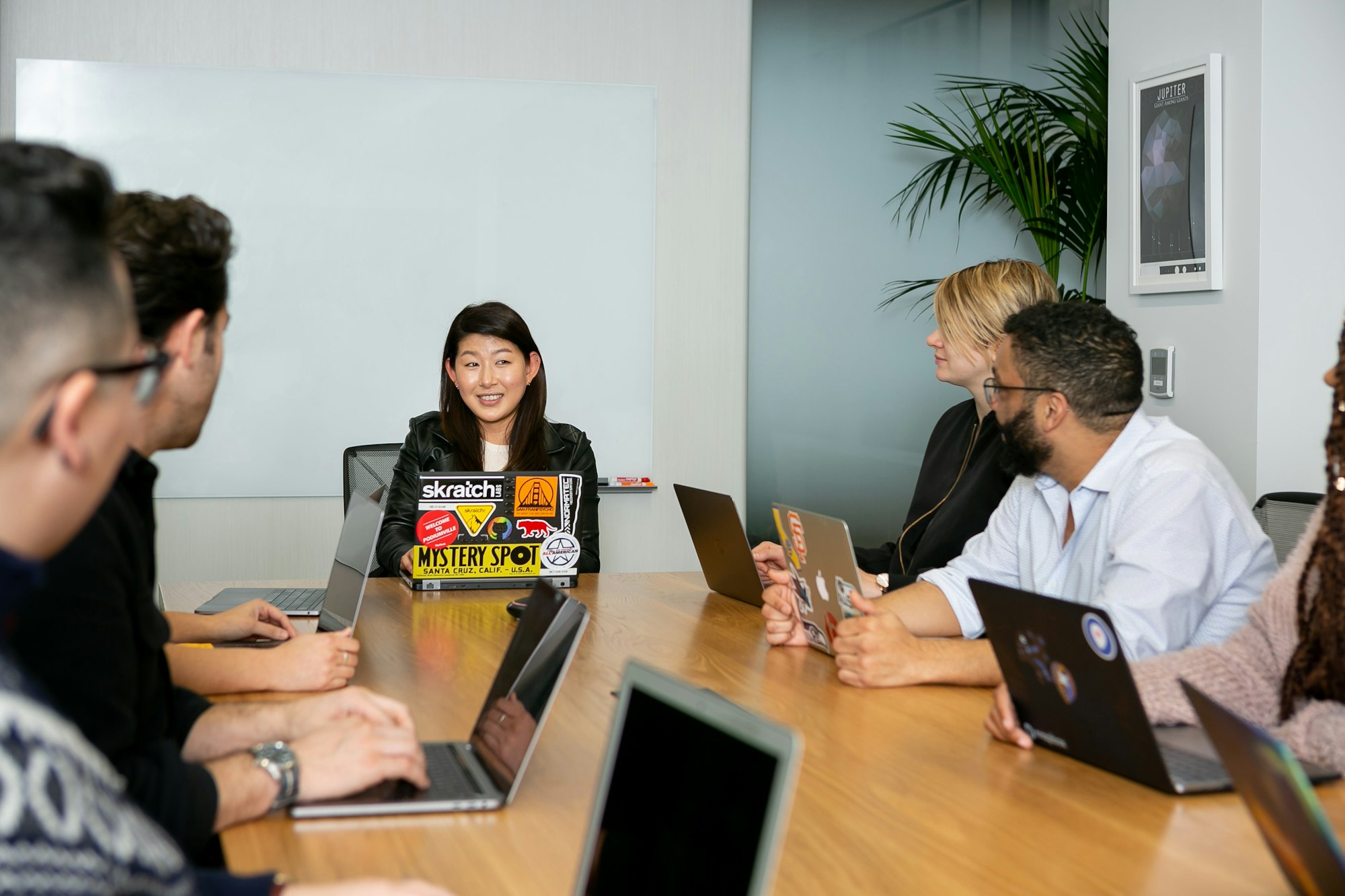 Team meeting where a manager discusses customer service performance