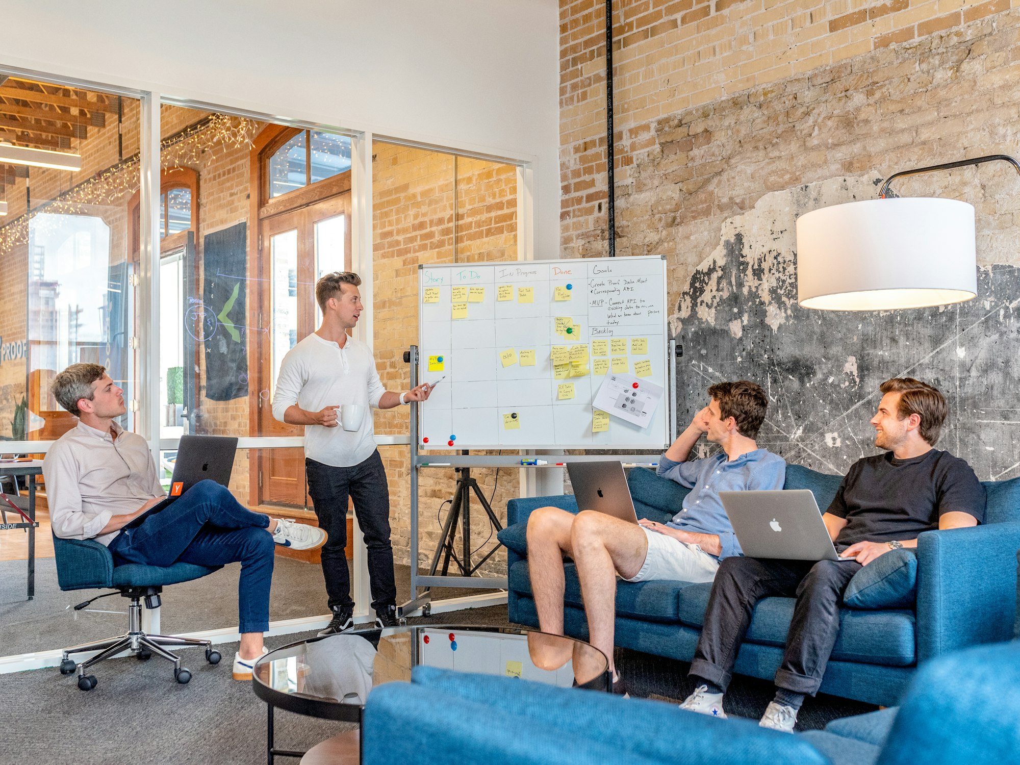 Customer service manager coaching a team member in a meeting room